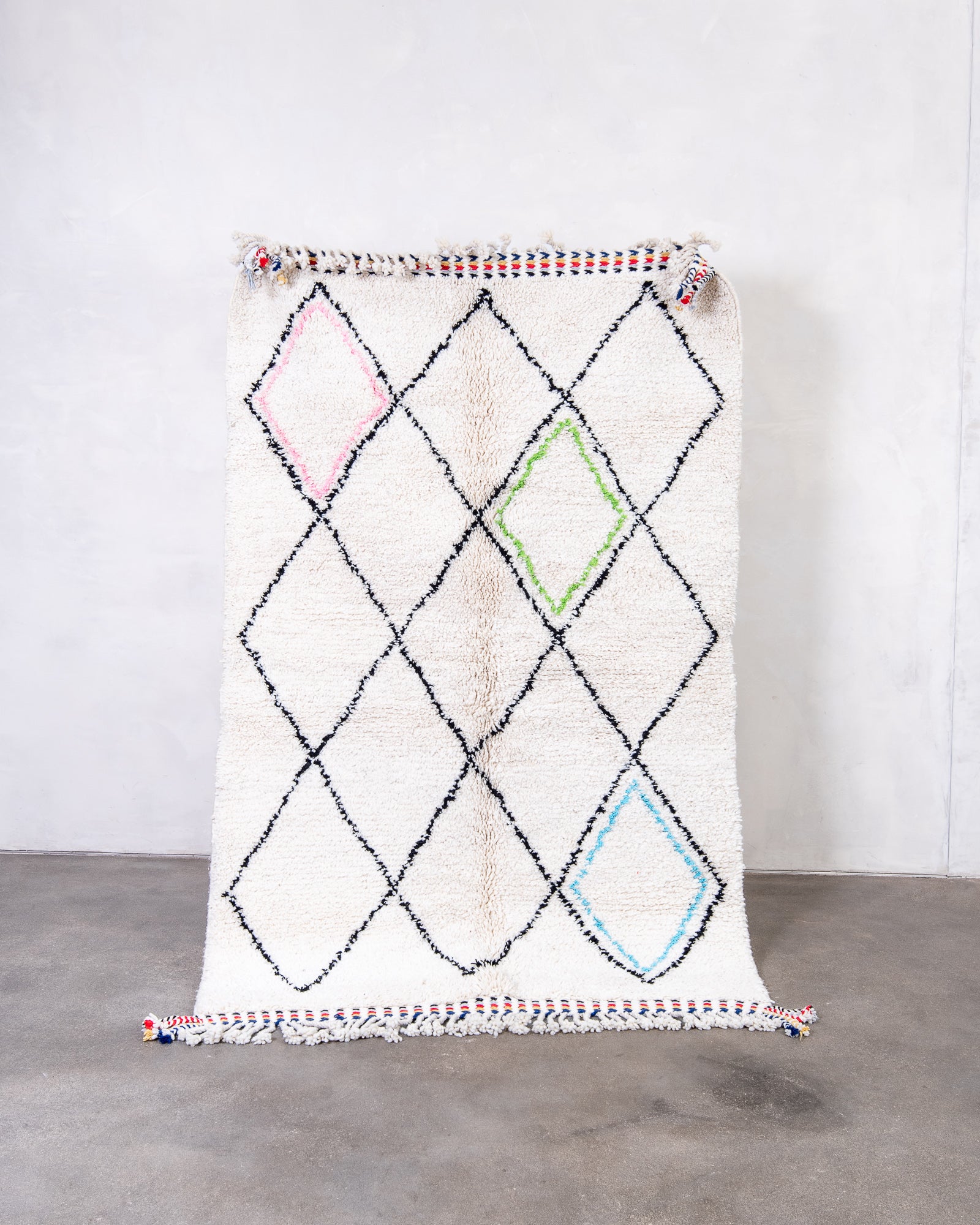 Modern, designer, handcrafted Berber rug from Morocco. Beniourain carpet with beautiful colours and patterns and fluffy wool texture.
